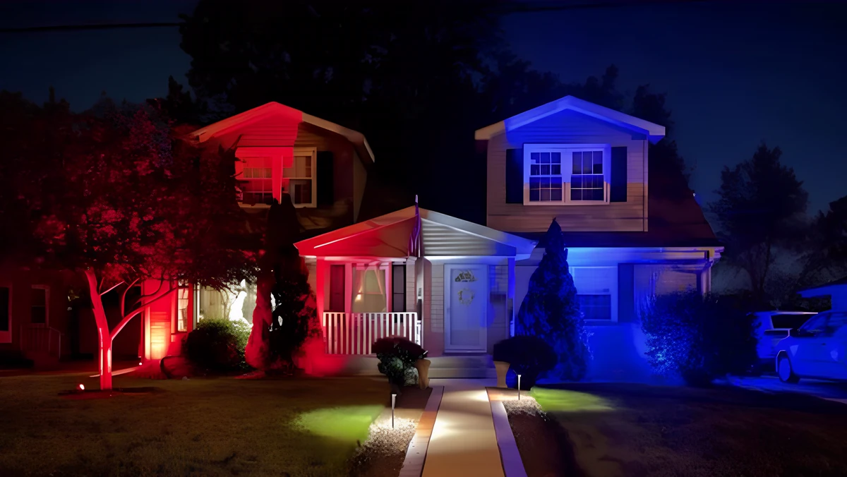 Red, white and blue patriotic outdoor lighting on homes at dusk in Wilmington, NC by Optic Lighting